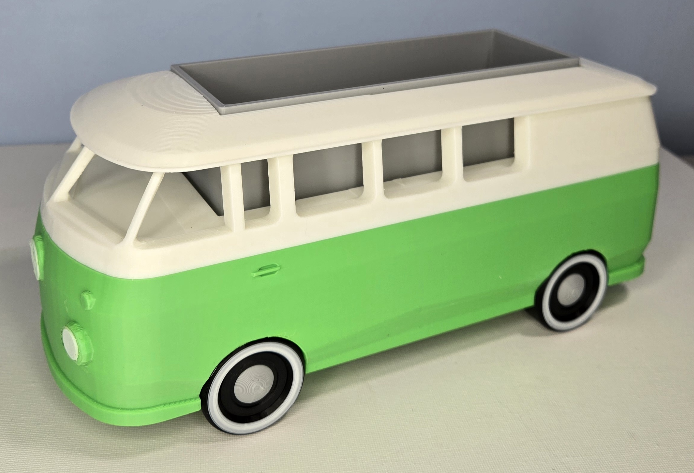 Green and white 3D printed retro campervan planter with a removable rooftop trough