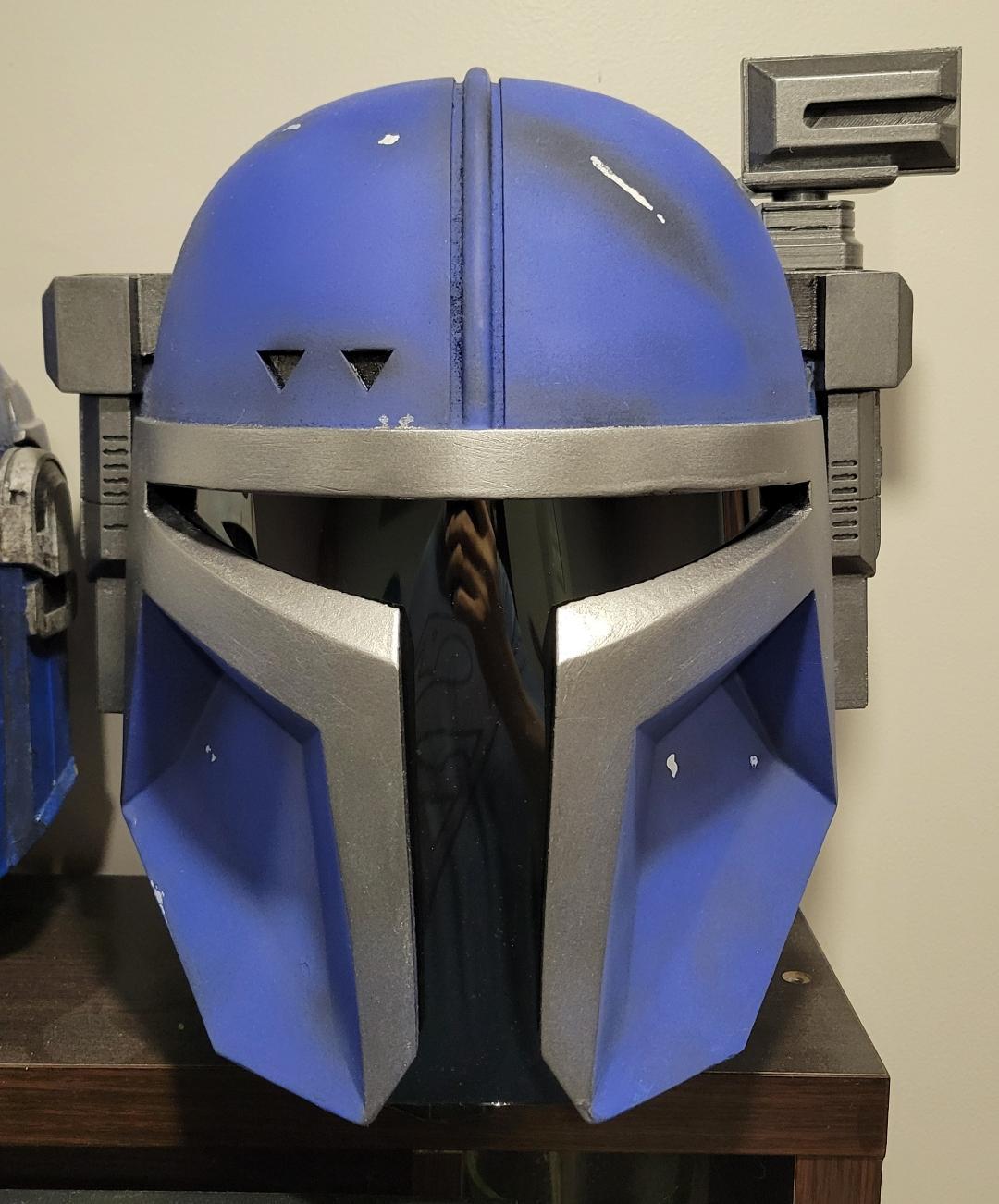 3D printed blue and silver Mandalorian-style cosplay helmet with range finder